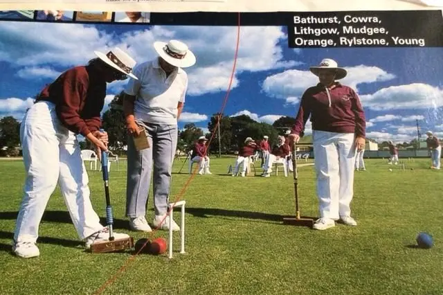 The front of an old phone book that features members of the Young Croquet Club from back in the day.