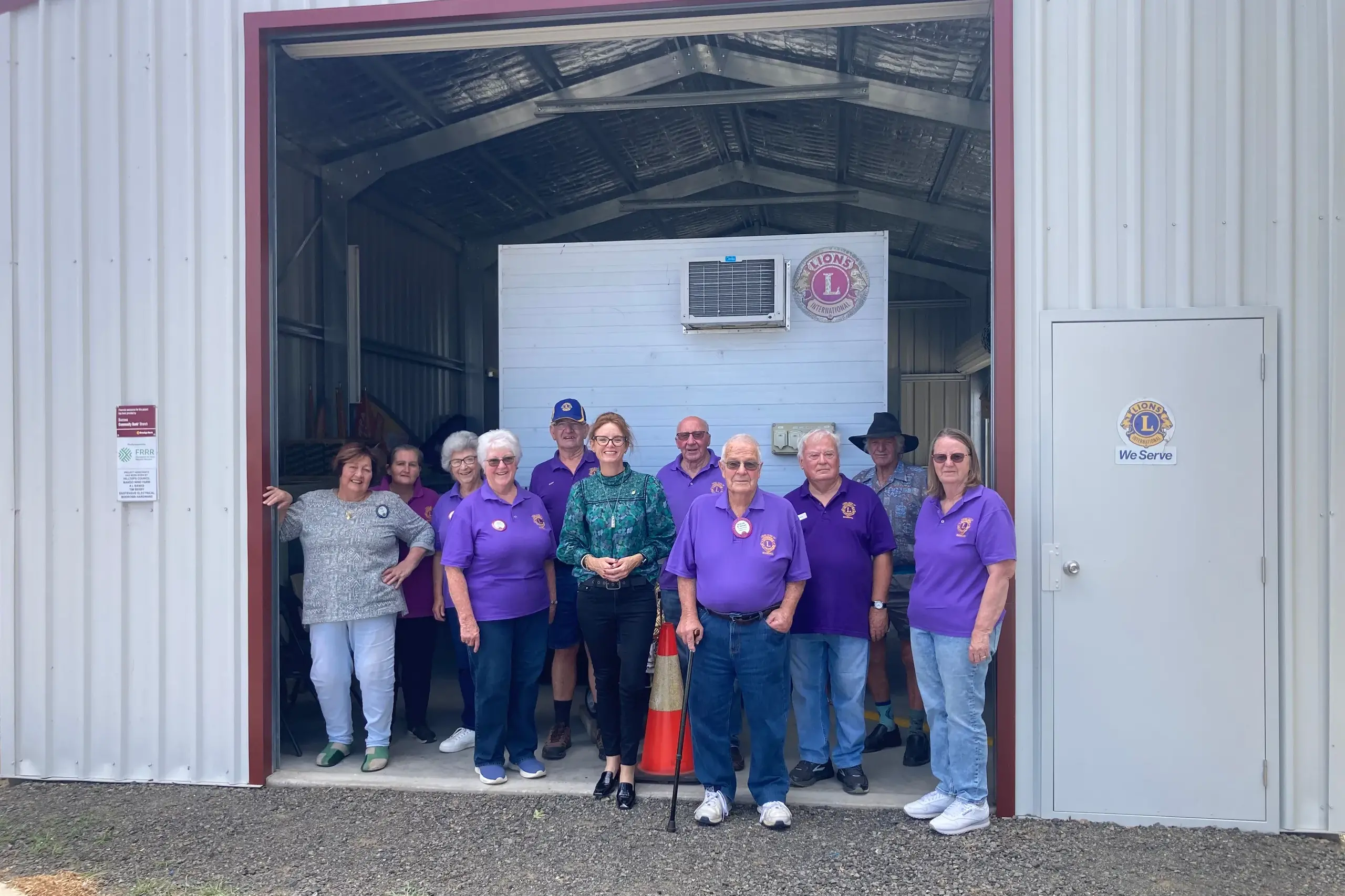 <p>Steph Cooke MP with members of the Boorowa Lions Club at their new shed. PHOTO: Supplied</p>\\n