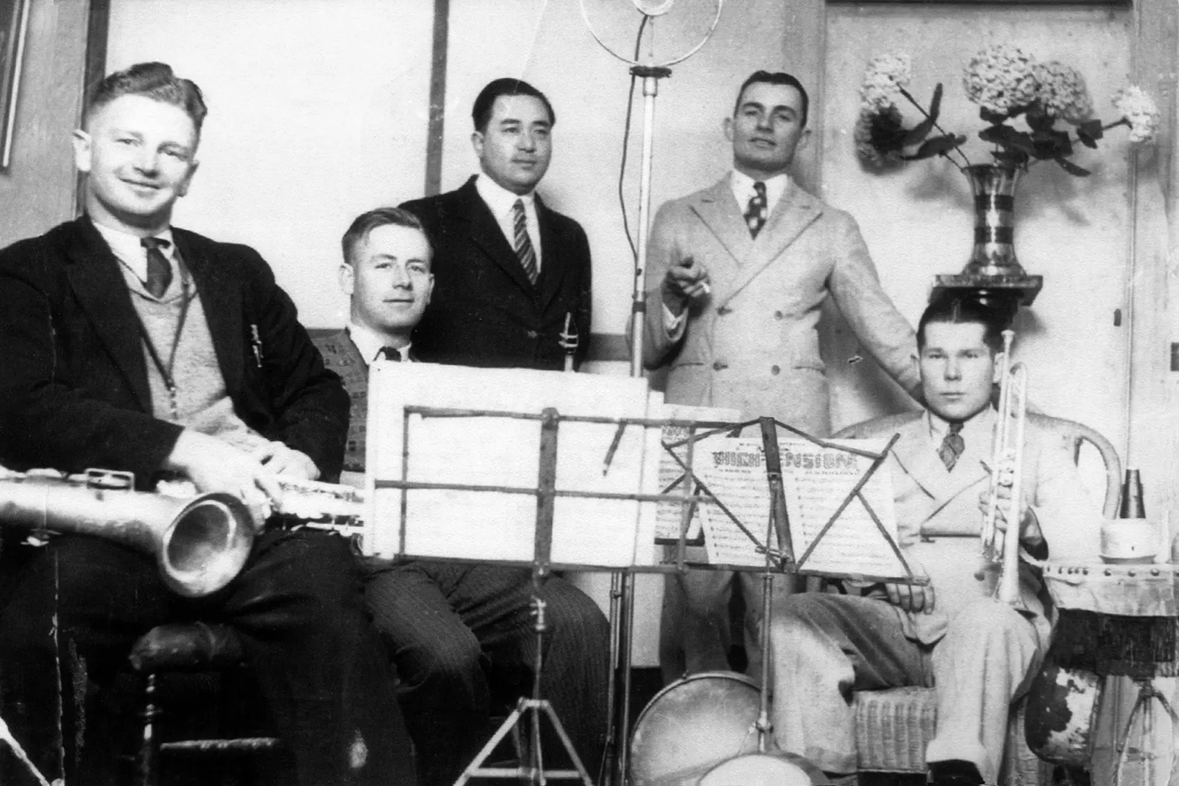 <p>Band membership over time and consisted of Les Quay (piano) standing centre in this photo, Raymond Cray (trumpet), Roy Casey, (tenor saxophone), Col Anderson (saxophone), Crawford Leslie (banjo), Reg \\u2018sting\\u2019 Nettlefold, drummer. PHOTO: Supplied</p>\\n