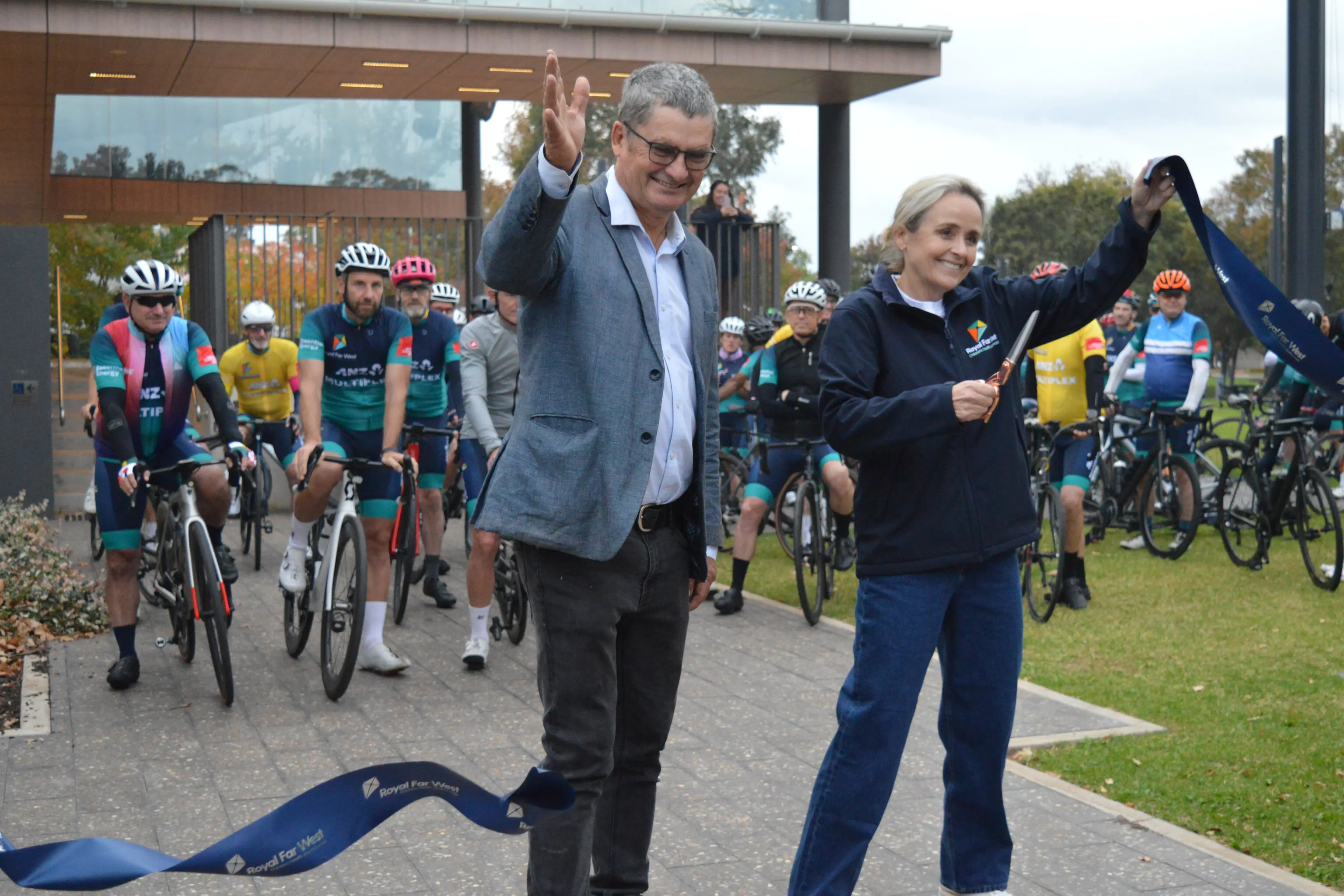 <p>It begins! Parkes Mayor Neil Wescott and Royal Far West CEO Dr Briony Scott cut the ribbon to officially mark the start of the Ride for Country Kids from Parkes. PHOTOS: Christine Little</p>\\n