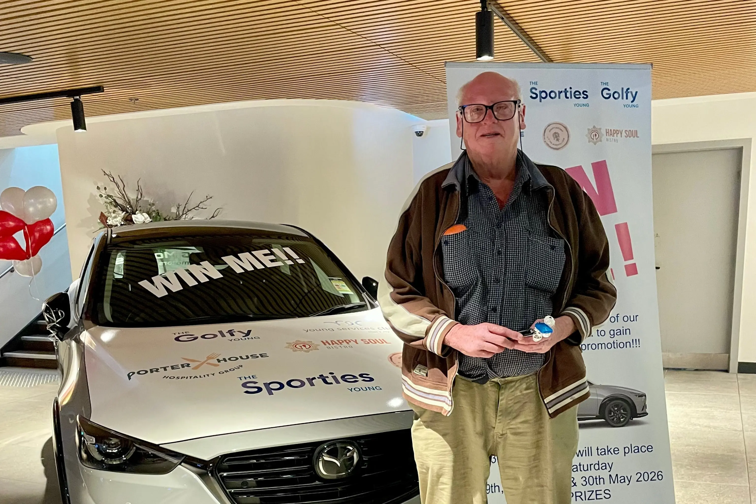<p>Local resident David Murray with the Mazda CX-3 he won after his lucky key unlocked the prize vehicle at the Young S&C Club\\'s major giveaway.</p>\\n