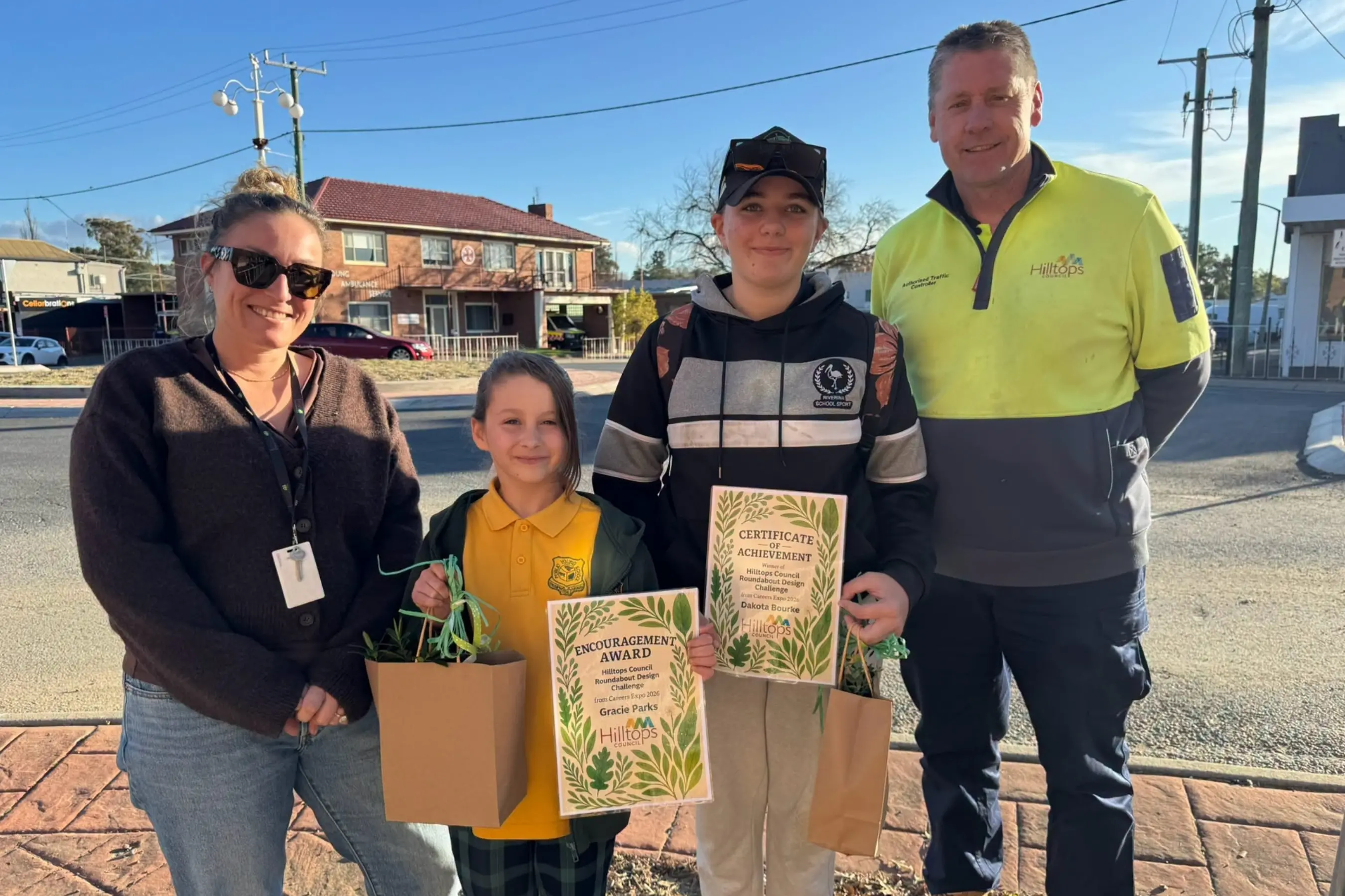 <p>Pictured are Hilltops Council Youth Officer Georgia Thomaidis, Encouragement Award recipient Gracie Parks, Roundabout Design Competition winner Dakota Bourke and Hilltops Council Open Spaces Coordinator Ted Hill.</p>\\n