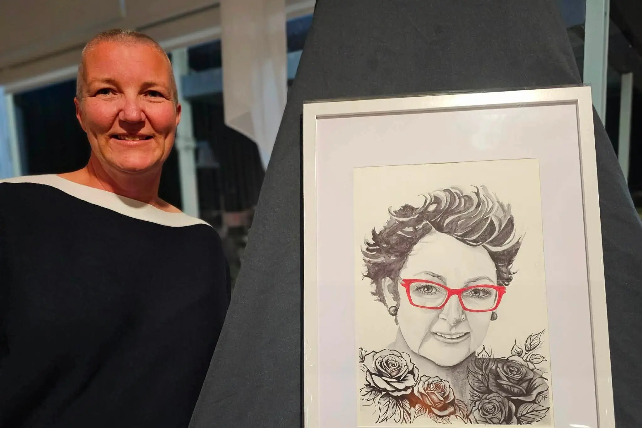 <p>Larissa with a portrait of Tania. </p>\\n
