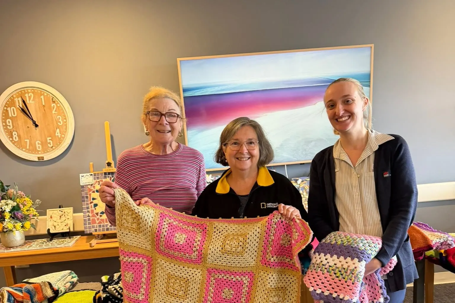 <p>Rotary Club of Murrumburrah-Harden have delivered hand-knitted and crocheted squares stitched together into colourful rugs and blankets to the residents of Harden Grange.</p>\\n