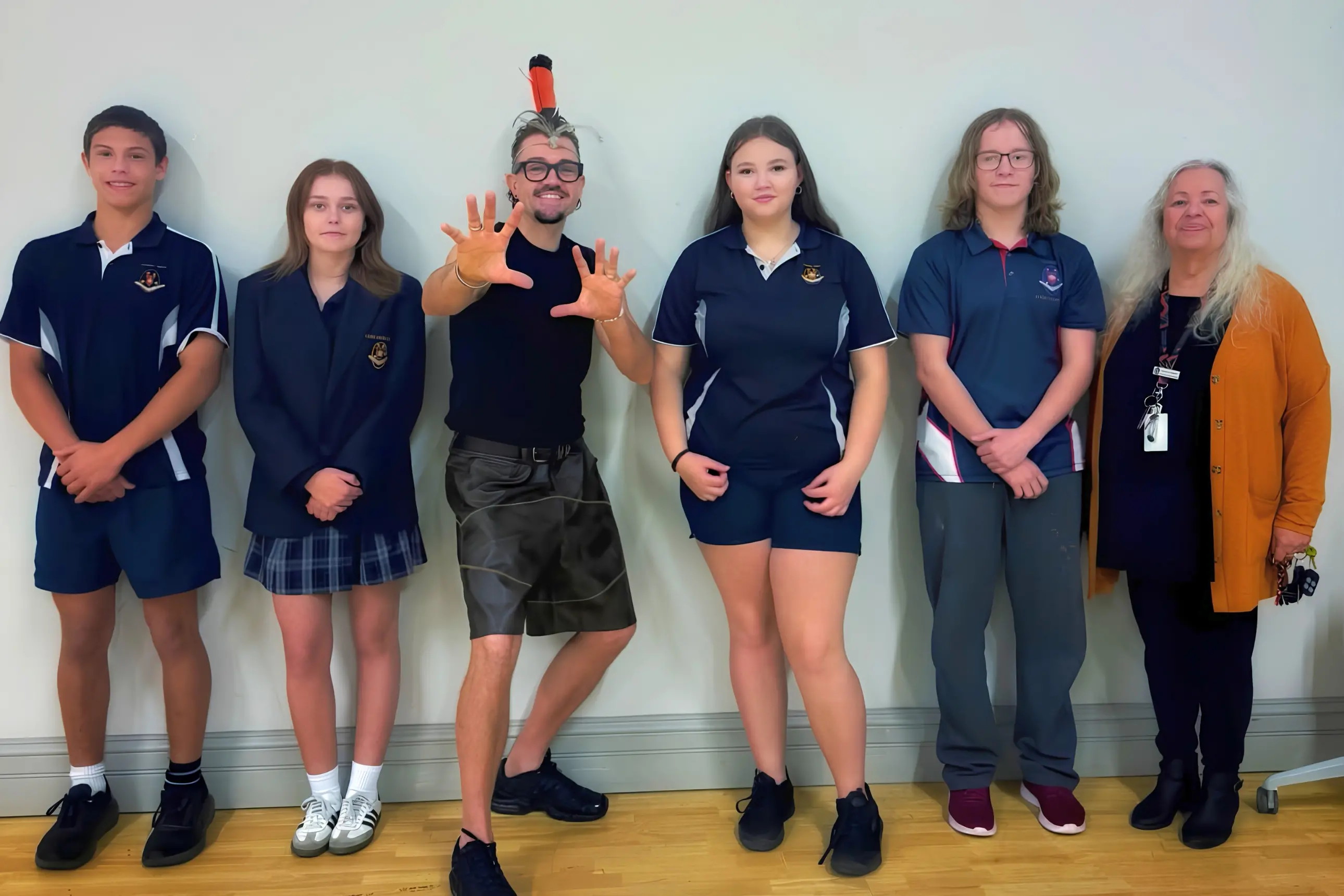<p>Mitch Tambo with Young High School students and local Elder Aunty Enid following his I Am Me performance at Young Town Hall.</p>\\n